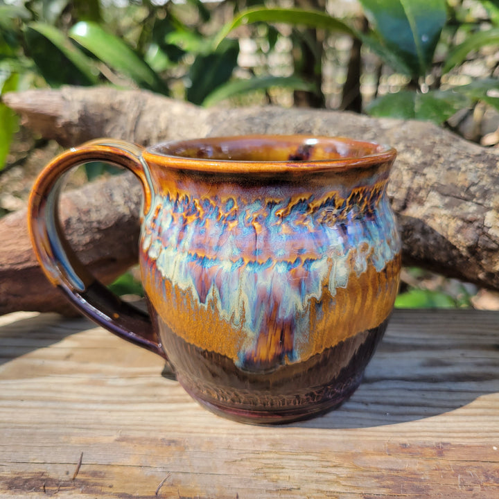 Mug glazed with dark brown and gold/blue accents_alt view