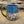 Load image into Gallery viewer, Mug is glazed with a deep indigo blue and iron wash applied on carved texture
