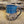 Load image into Gallery viewer, Mug is glazed with a deep indigo blue and iron wash applied on carved texture
