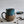 Load image into Gallery viewer, Carved mug is glazed with an indigo blue glaze
