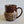 Load image into Gallery viewer, Carved mug is glazed with a deep red glaze
