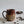 Load image into Gallery viewer, Carved mug is glazed with a deep red glaze
