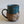Load image into Gallery viewer, Carved mug is glazed with an indigo blue glaze.
