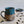 Load image into Gallery viewer, Carved mug is glazed with an indigo blue glaze.
