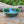 Load image into Gallery viewer, Wheel-thrown bowl with blue glazed interior and greenish brown accents on rim
