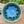 Load image into Gallery viewer, Wheel-thrown bowl with blue glazed interior and greenish brown accents on rim_overhead view
