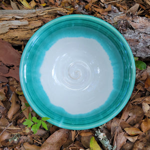Wheel thrown bowl with cream interior and celadon glaze and muted chatter texture on exterior
