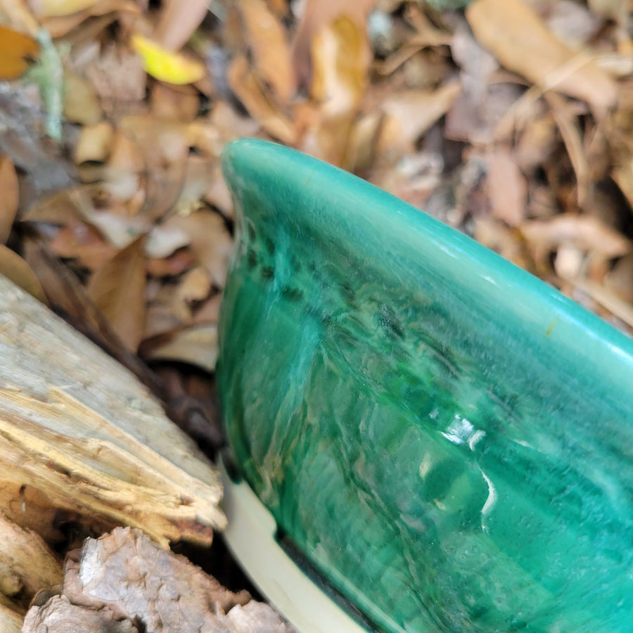 Wheel thrown bowl with cream interior and celadon glaze and muted chatter texture on exterior_close up