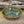 Load image into Gallery viewer, Wheel thrown bowl has a blue celadon glaze with additional blue-green accents
