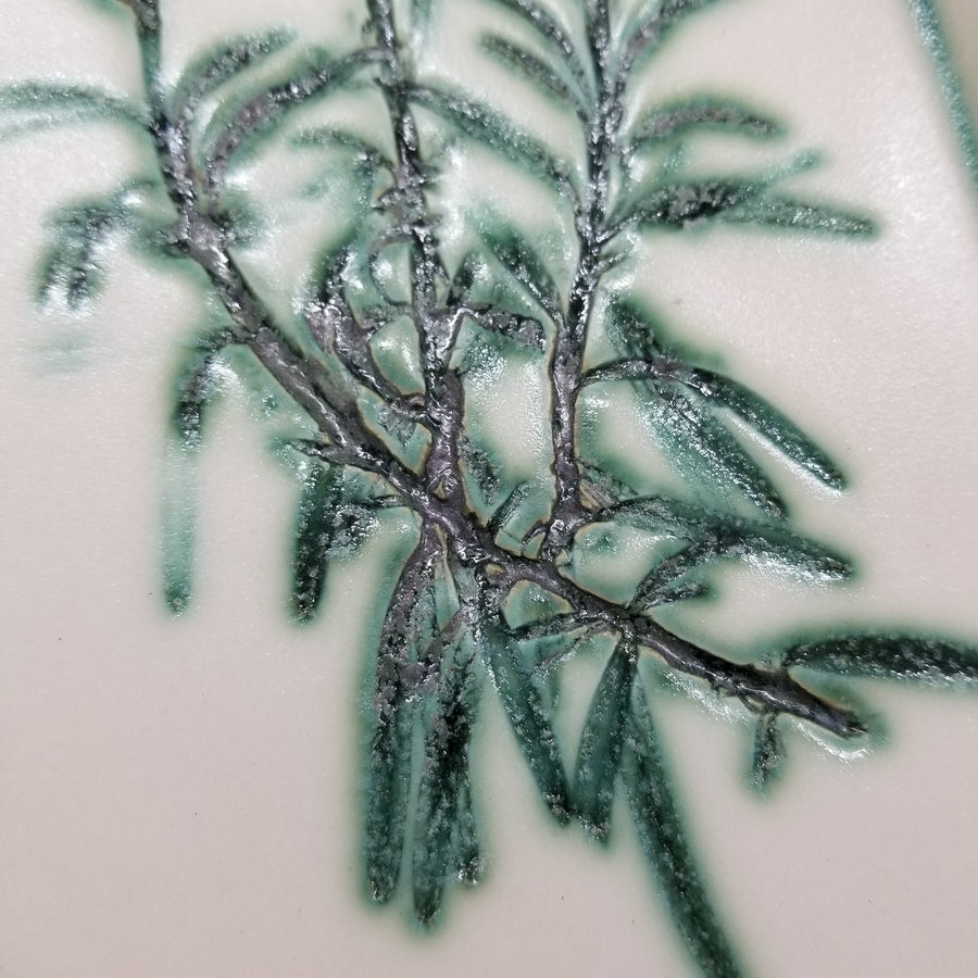 Ceramic serving tray with rosemary texture inlay and green accents-close up