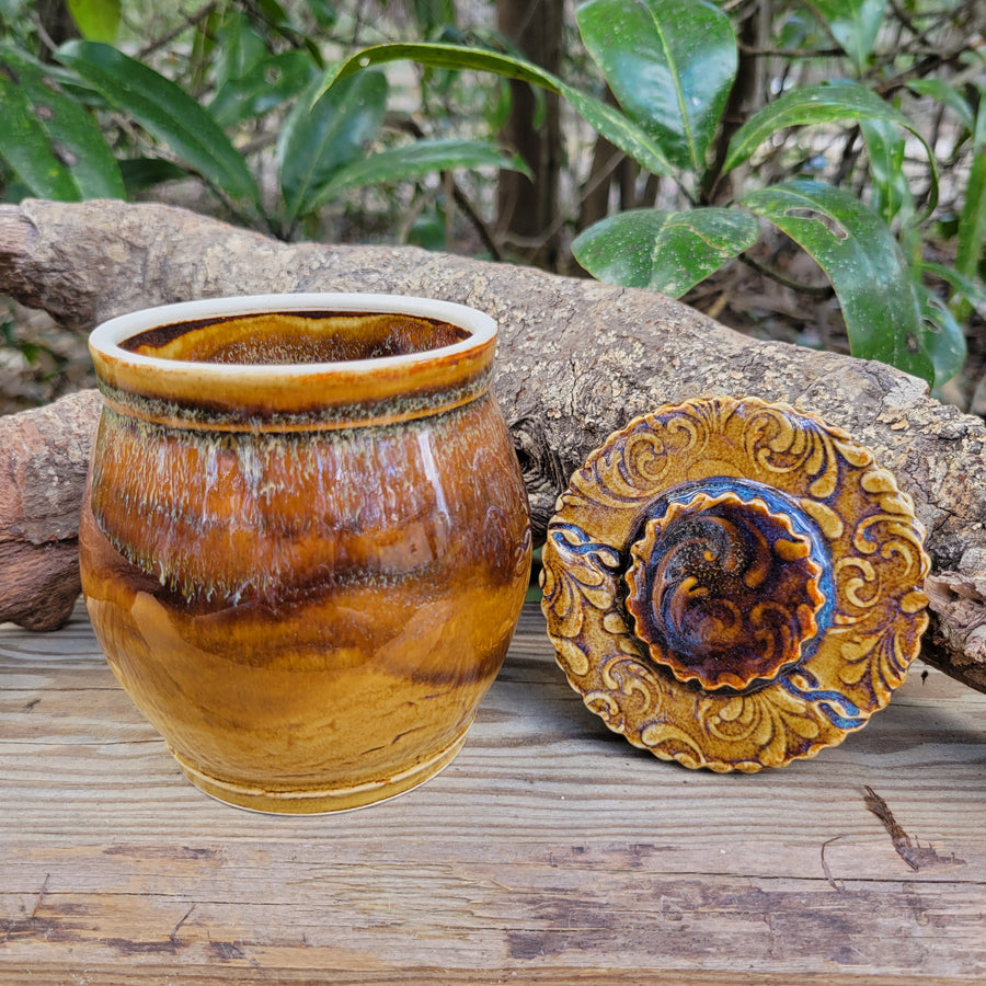 Lidded jar with amber celadon glaze and texture on lid_lid detail