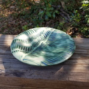 Leaf textured green & cream colored soap dish.