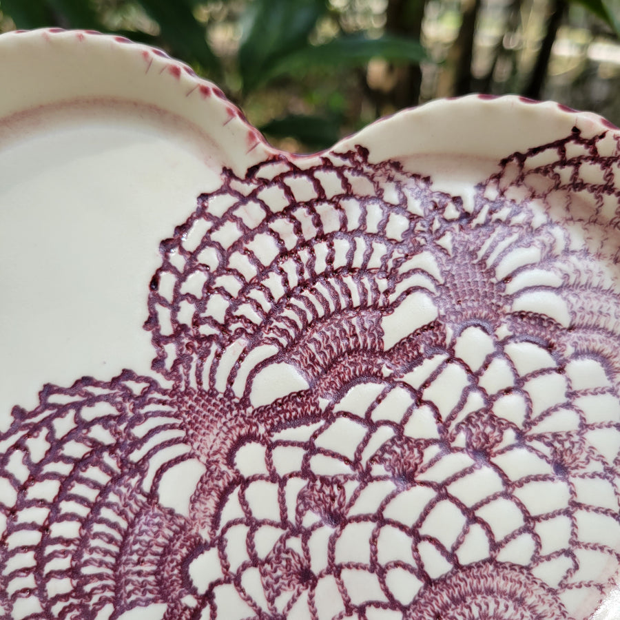 Heart shaped trinket dish with burgundy lace texture_close up
